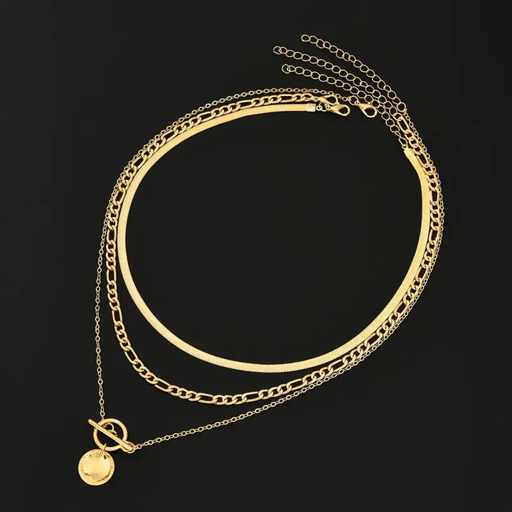 Gold Layered Necklace with Textured Coin Design by Savira