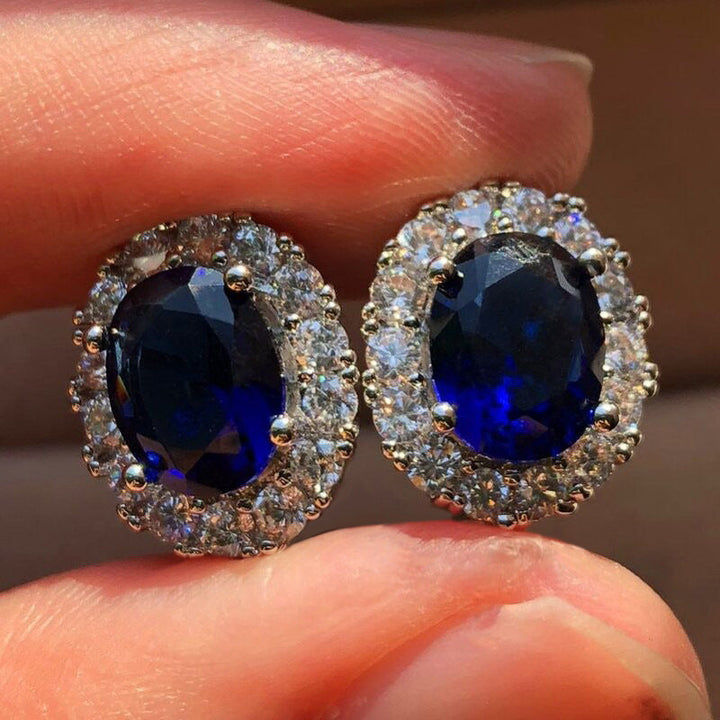 Oval White Sapphire Stud Earrings in White Gold